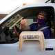Dr. Bret Frey, an emergency medicine physician, points to a step stool he brought so a nurse could reach their arm inside a truck to administer the first dose of the Pfizer-BioNTech covid-19 vaccine under an emergency use authorization at a drive-up vaccination site from Renown Health on December 17, 2020, in Reno, Nevada.